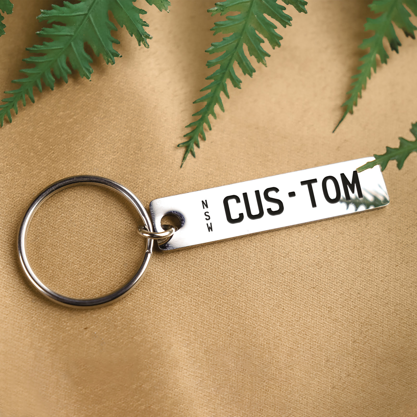 Show off style and personality with our metal bar plateit keyring