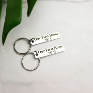 Our first home metal bar keyring