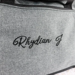 Embroidered grey duffle bag with personalised design