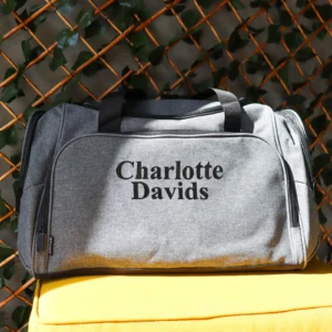 Embroidered grey duffle bag with personalised design