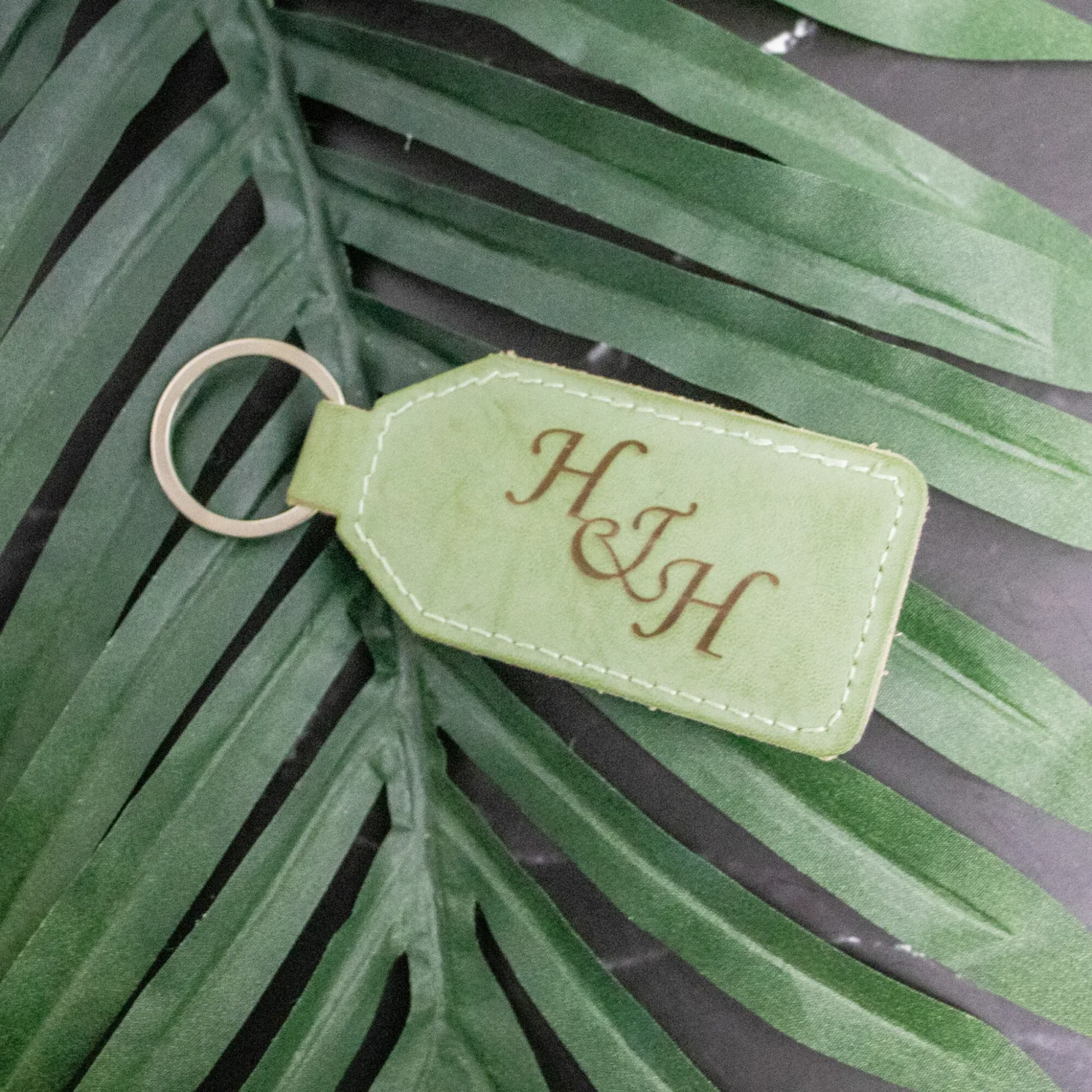 Personalised green leatherette keychain