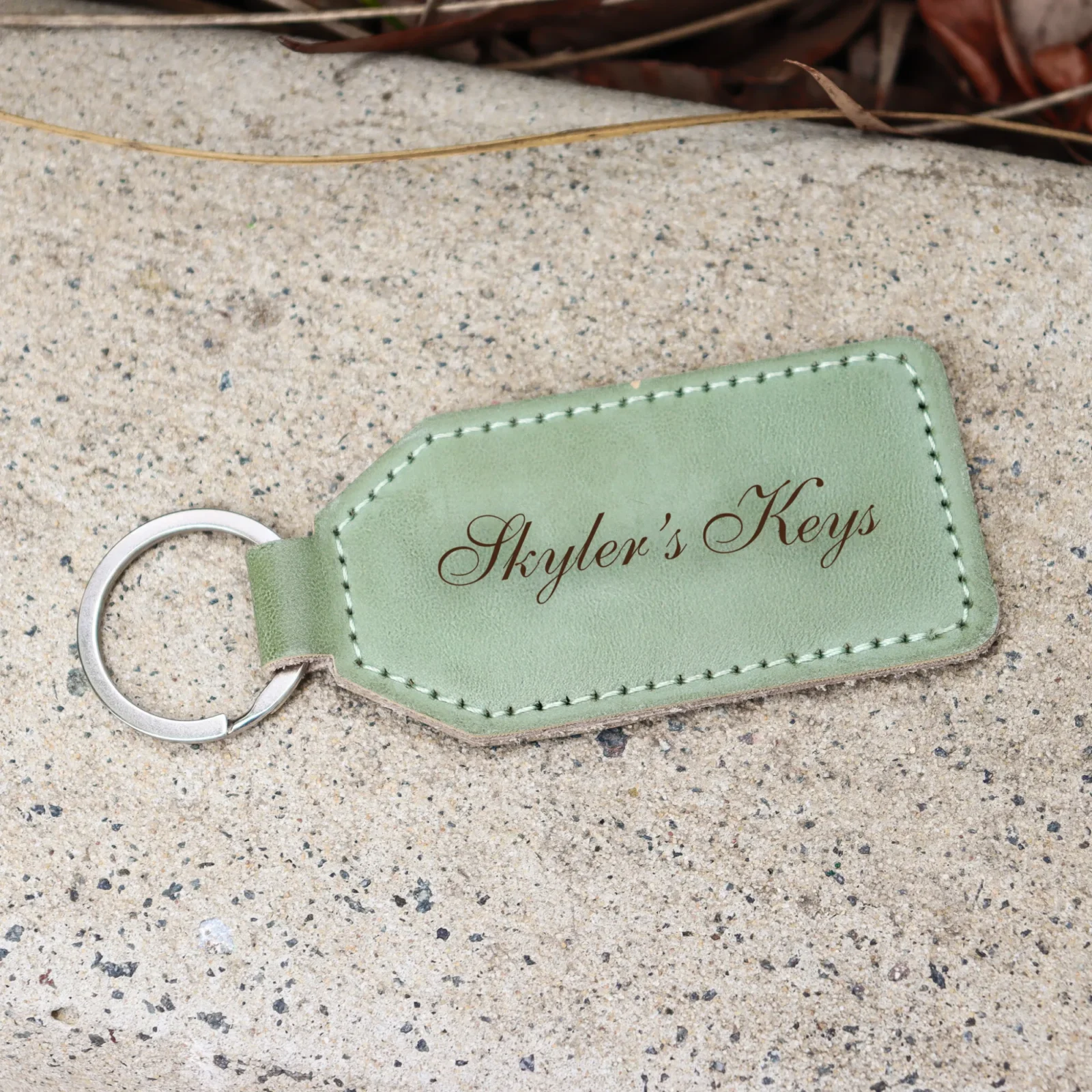 Personalised green leatherette keychain