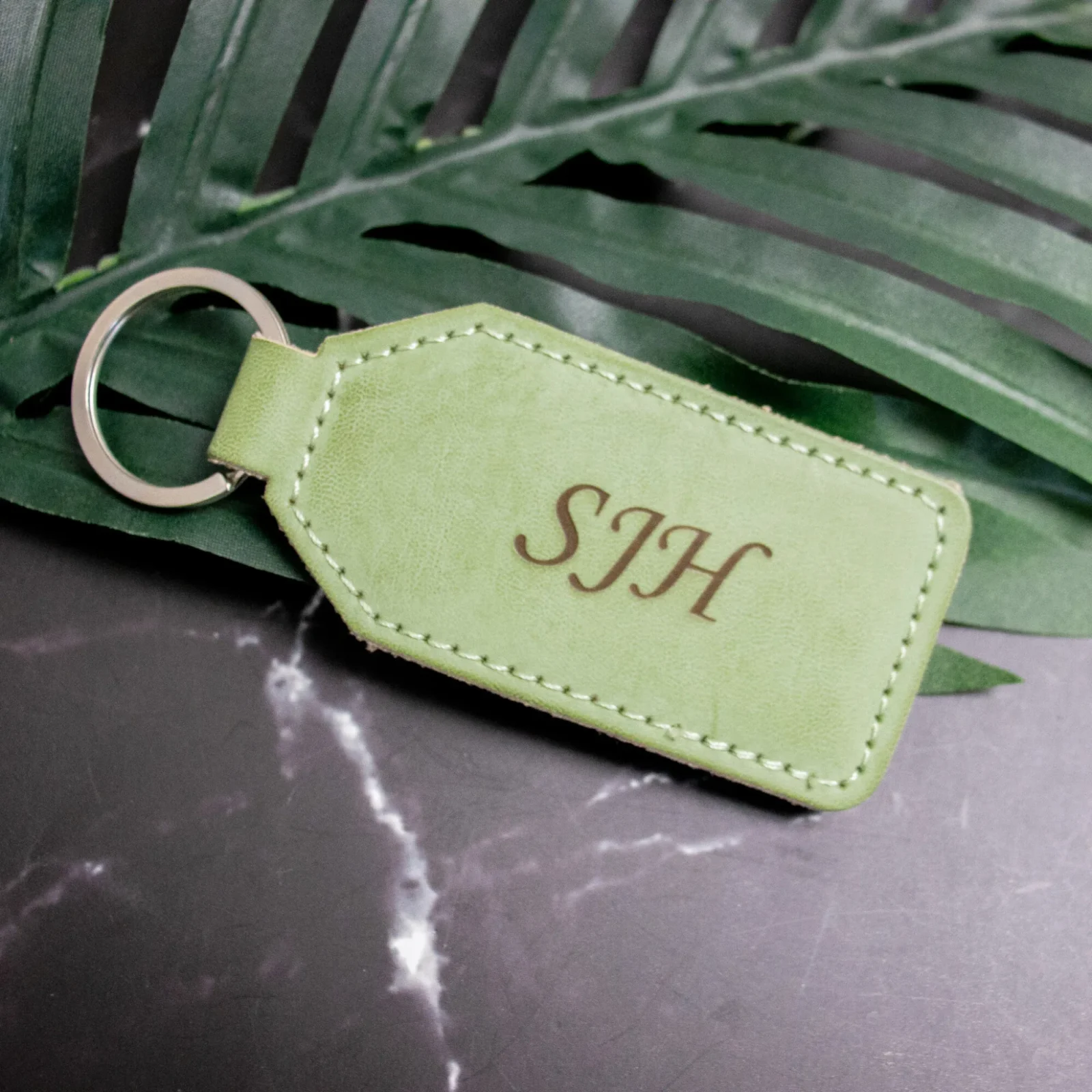 Personalised green leatherette keychain